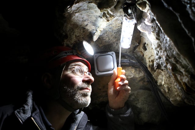 Experienced pot holer Alan Walker has spent the winter installing computer controlled LED lighting in Poole's Cavern in 2011