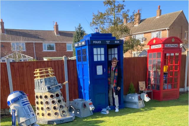 Ricky Butler with his TARDIS and collection of sci-fi replica models.