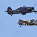 A Spitfire and a Hurricane in flight.