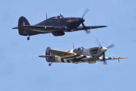 A Spitfire and a Hurricane in flight.