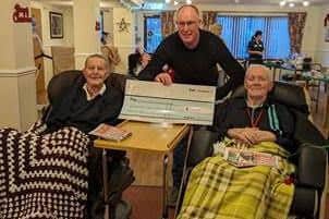 Rob presented the home with a cheque following the conclusion of the challenge. He is pictured with Colin Picken and Eddie Henshaw.