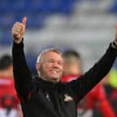 Doncaster's manager Grant McCann celebrates after the final whistle at Tranmere.