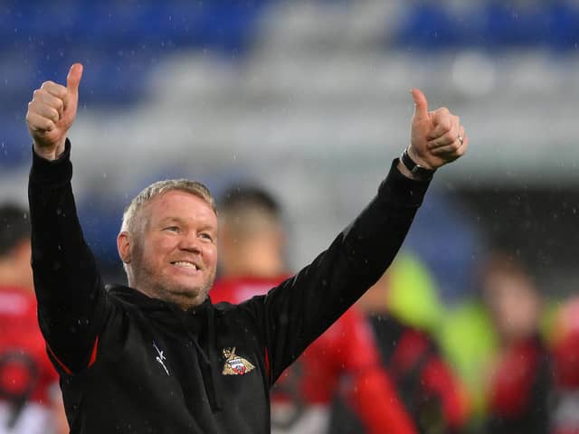 Doncaster's manager Grant McCann celebrates after the final whistle at Tranmere.