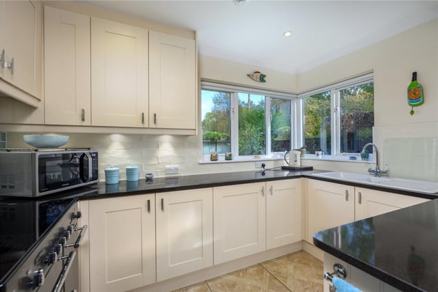 The kitchen units include a Toledo Rangemaster electric cooker with induction hob, grill and double oven, an integrated dishwasher, a 1.5 sink, and free standing Liebherr fridge and freezer.