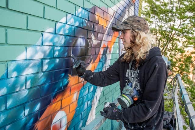 International street artist Peachzz to create new mural at library.