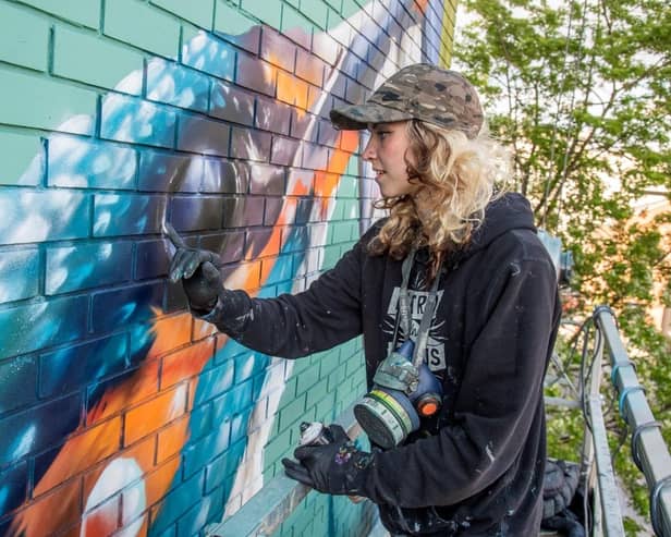 International street artist Peachzz to create new mural at library.