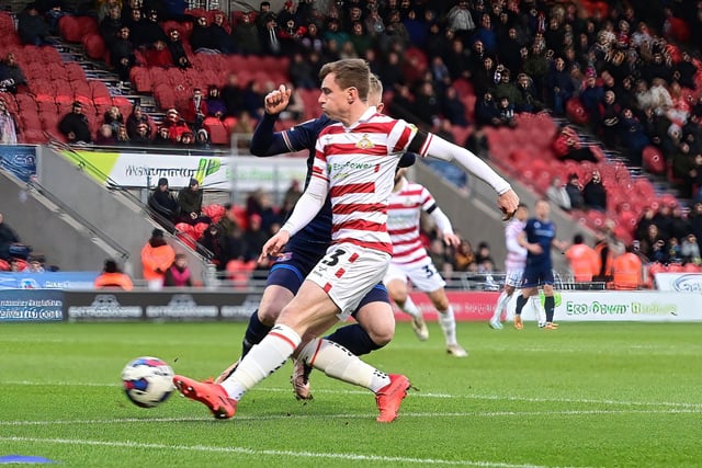 Doncaster's James Maxwell scores the opening goal.