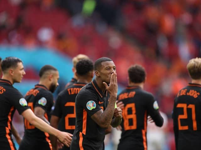 Netherlands' midfielder Georginio Wijnaldum celebrates scoring against North Macedonia. Photo by KENZO TRIBOUILLARD/POOL/AFP via Getty Images