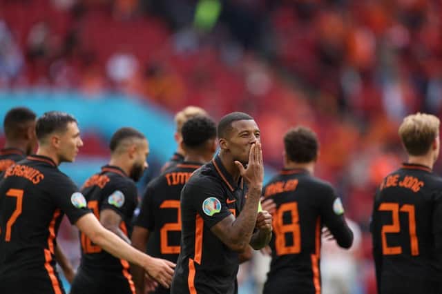 Netherlands' midfielder Georginio Wijnaldum celebrates scoring against North Macedonia. Photo by KENZO TRIBOUILLARD/POOL/AFP via Getty Images