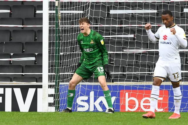 Louis Jones shows his frustration after conceding against MK Dons. Picture: Howard Roe/AHPIX