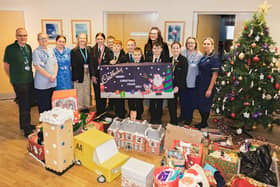 St John’s Hospice staff are pictured receiving the Christmas hampers from staff and students from Sir Thomas Wharton Academy.