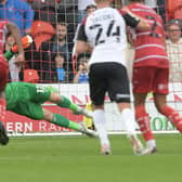 Pontus Dahlberg saves Shaun Williams' penalty against Portsmouth. Picture: Howard Roe/AHPIX
