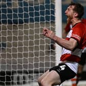 Tom Anderson shows the raw emotion after scoring in the thumping win at Colchester.