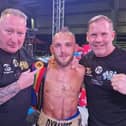 Craig Derbyshire and team celebrate winning the Commonwealth light-flyweight title.