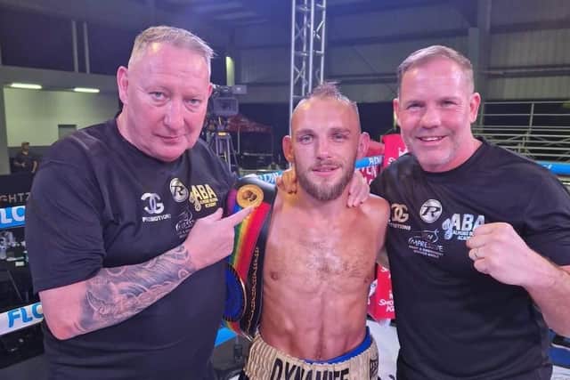 Craig Derbyshire and team celebrate winning the Commonwealth light-flyweight title.