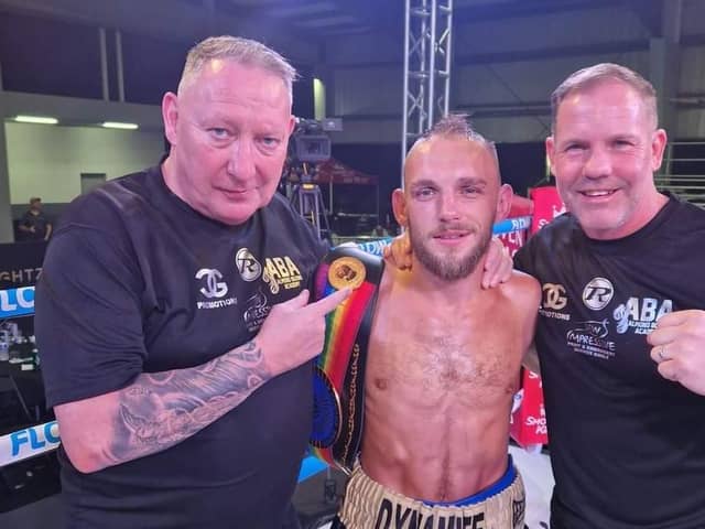 Craig Derbyshire and team celebrate winning the Commonwealth light-flyweight title.