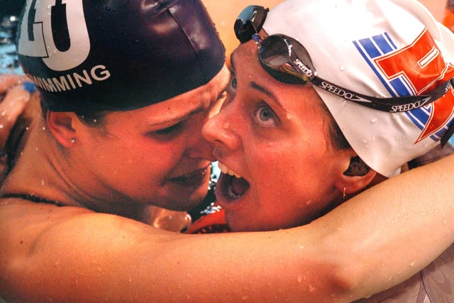 Overjoyed at winning the 200 Metre Backstroke Final Katy Sexton (right) hugs 2nd Karen Lee in 2004