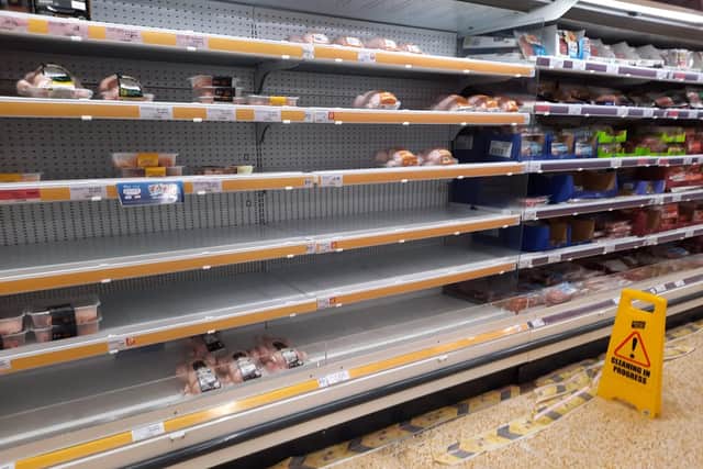 Empty meat shelves.