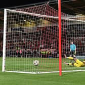Charlie Kirk scores the winning penalty for Crewe.