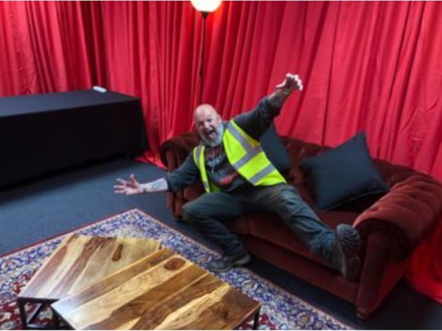Nidge takes a breather after helping to construct The Killers' dressing rooms.