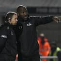 Darren Moore speaks to assistant Jamie Smith at Northampton. Picture: Howard Roe/AHPIX