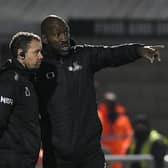 Darren Moore speaks to assistant Jamie Smith at Northampton. Picture: Howard Roe/AHPIX
