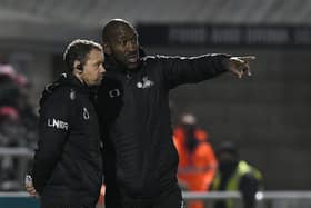 Darren Moore speaks to assistant Jamie Smith at Northampton. Picture: Howard Roe/AHPIX