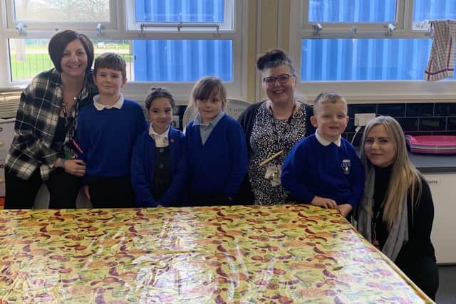 Breakfast club team - Miss Johnson, Mrs Manson and Mrs Shaw - with some of the regular attendees of the breakfast club who will benefit from this fantastic donation