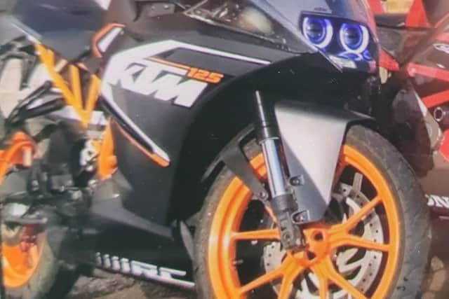 KTM RC125 WU66VGN. The picture of the bike is different from how it looks now. The bike is now all black with black wheels and no stickers.