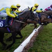 Runners clear a flight of hurdles during The Sky Bet UKs No.1 Betting App Novices' Hurdle at Doncaster Racecourse on January 27, 2023. Photo by Alan Crowhurst/Getty Images
