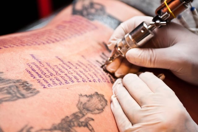 Former soldier Shaun Clark, aged 43, has the names of every British soldier killed in Afghanistan tattooed on his back at the Fantasy Tattoo Studio in Doncaster. Tattooist Kevin Kent is provided his services for free, and Shaun hopes to raise £500 for forces' charities;