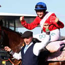 Jockey Rachael Blackmore celebrates on A Plus Tard after winning the Cheltenham Gold Cup. Photo by ADRIAN DENNIS/AFP via Getty Images