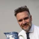 Charles Hanson with an 18th century Staffordshire pearlware jug which sold for £170. Credit: Hansons