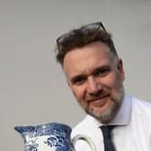 Charles Hanson with an 18th century Staffordshire pearlware jug which sold for £170. Credit: Hansons
