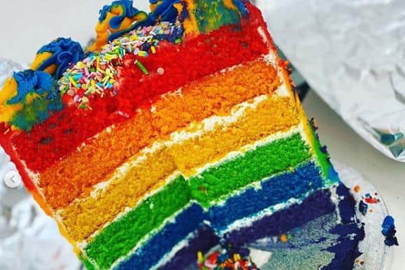 Rainbow layered cake made by Adam.