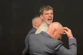 One protester was led away by security after heckling Mr Farage.