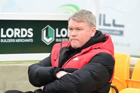 Grant McCann was content to snatch a late point at drop rivals Sutton.