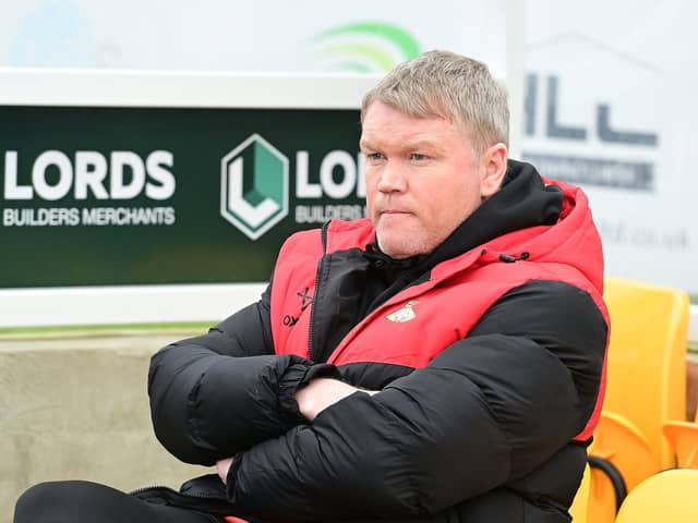 Grant McCann was content to snatch a late point at drop rivals Sutton.
