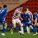 Tommy Rowe tries to find a way forward against Harrogate Town.