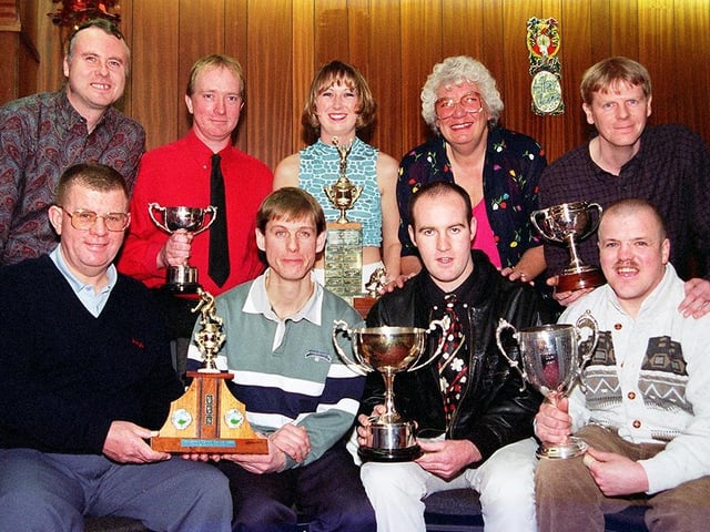 The Doncaster and District Bowling Association held its annual presentation night at the Dupont Social Club on November 5, 1997. Our picture shows association secretary Liz Hall, back row, fourth left, with the multi-trophy winning Bentley Colliery. They are, back row, from left, Graham Garnet, Paul Morgan, Katrina Caley, and Graham Fox; front row, Ken Booth, Mal Fox, captain Kevin Nixon and Melvin Axe, December 1997