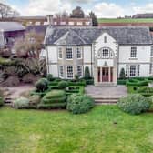The six bedroom property sits on a five-acre plot, with landscaped gardens, tennis courts and an annexe converted from stables.