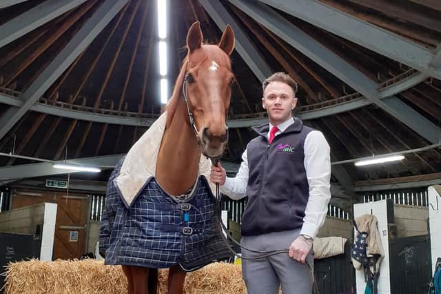 Engagement assistant Haydn Cahill in the stables at the National Horseracing College at Rossington Hall