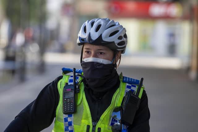 26 March  2020 .....  A Police Community Support Officer patrols the centre of Doncaster in a face mask for protection during to coronavirus pandemic. Picture Tony Johnson