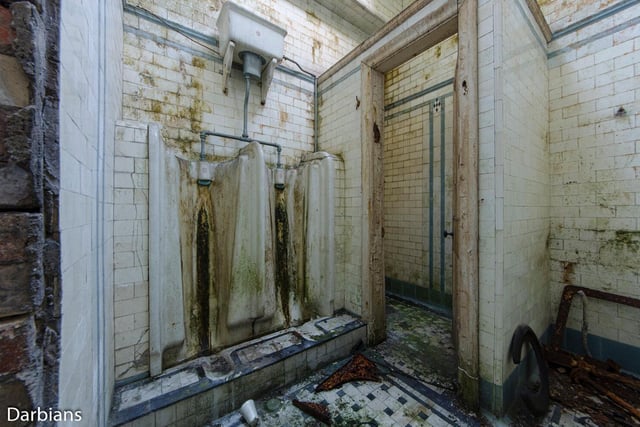 A very dirty urinal in the bath house - pre-restoration. Photo by Darbians Photography