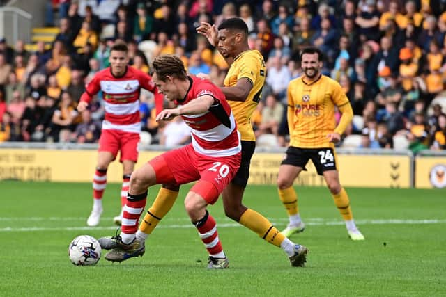 Joe Ironside holds the ball up for Doncaster Rovers.