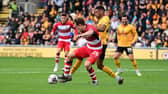 Joe Ironside holds the ball up for Doncaster Rovers.