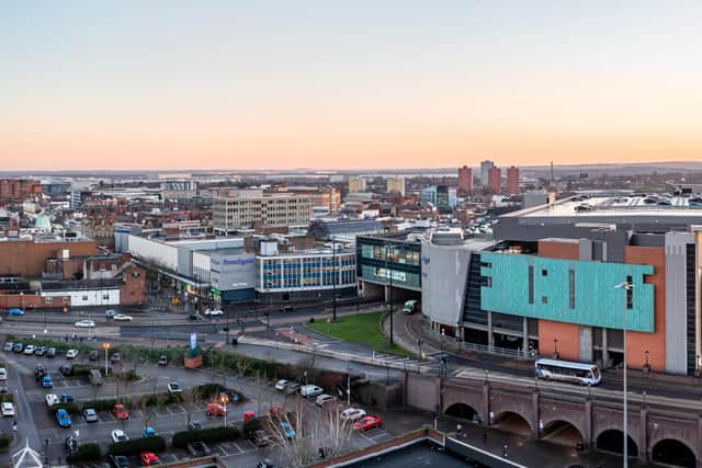 An aerial panorama view of the Frenchgate shopping and retail centre in Doncaster city centre with road links at sunset