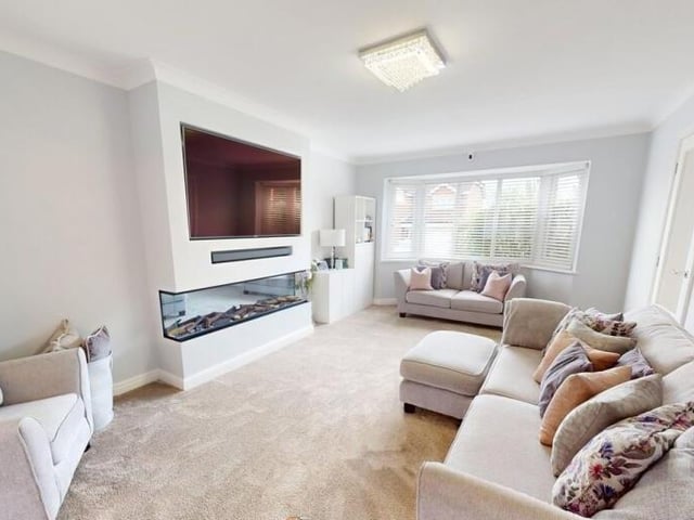 The spacious and modern lounge is open plan to a large playroom.