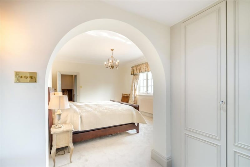 An archway leads in to the main bedroom, that has a luxury dressing room and an en suite.