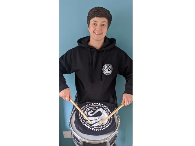 Ashley Danwood banging the drum
